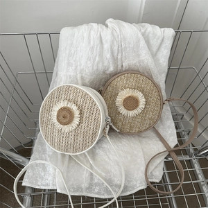 Sac bandoulière rond en paille tissée avec motif tournesol en blanc et kaki