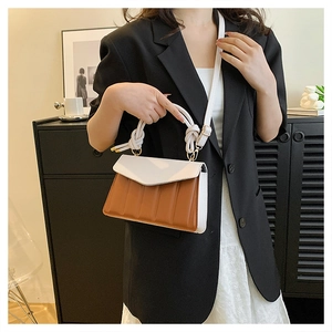 Fashionable color-block crossbody bag with pleated texture and knotted top handle