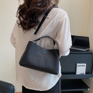 Minimalist black faux snake skin tote bag for women with silver hardware shoulder strap