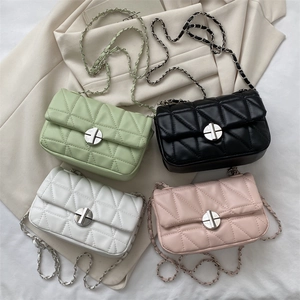Quilted crossbody bags with chain straps in green, black, white and pink displayed together