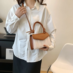 Fashion color-block handbag with brown flap and vertical embossed texture on white body