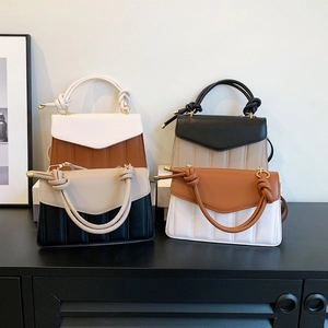 Quilted fashion handbags in color-block designs with unique knotted top handles