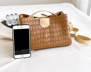 Crocodile pattern tote bag with smartphone for size comparison showing daily capacity