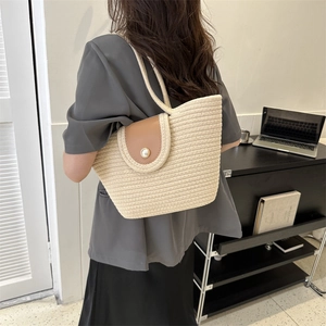Chic woven tote bag in off-white with brown leather flap and pearl detail accent