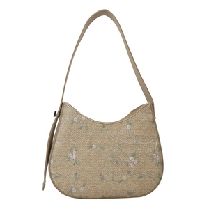 Handmade woven straw shoulder bag with floral embroidery and brown leather strap