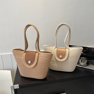 Large woven tote bags in khaki and cream with leather flaps and decorative pearl button