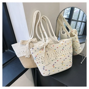 Detail of woven tote bags with lace bows and colorful patterns in a stylish setting