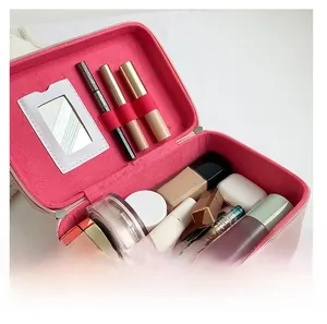 Pink faux leather makeup case detail with vanity mirror and spacious inner storage