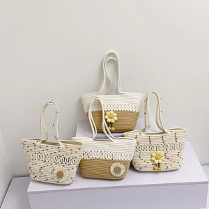 Handmade crochet summer beach tote bags with daisy flower accents and long handles