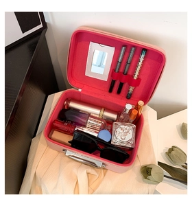 Pink quilted vanity case interior with mirror and slots for makeup brushes and skin care