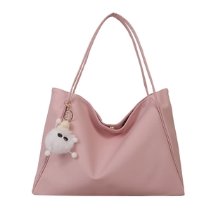 Pink faux leather tote bag with a white plush doll pendant and magnetic buckle