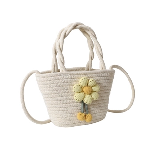 Straw weave bucket beach bag with floral decor and adjustable crossbody strap