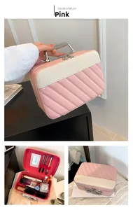 Pink striped cosmetic case featuring internal mirror and makeup brush organizers