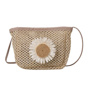 Summer woven straw crossbody bag with white daisy flower detail and brown leather trim