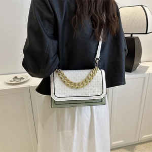Women's two-tone woven shoulder bag with gold chain strap in minimalist green and white