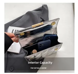 Internal capacity of silver quilted handbag showing space for phones and lipsticks