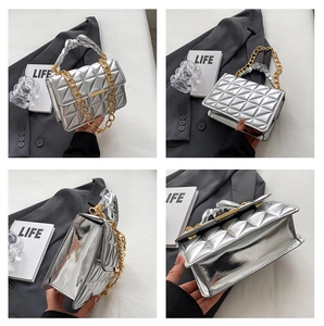 Detailed views of a silver quilted handbag with golden chain strap and ruched handle detail