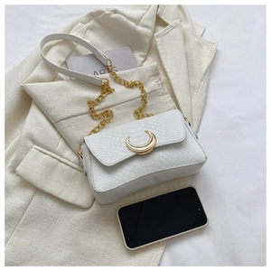 Detailed close-up of white snake-embossed leather texture with a gold crescent buckle