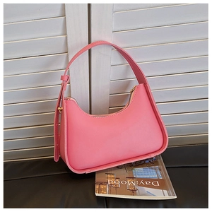 Pink PU leather underarm bag with adjustable strap and golden zipper on magazine