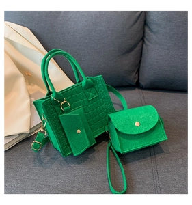 Three-piece vibrant green felt tote bag set with crocodile texture and metal hooks