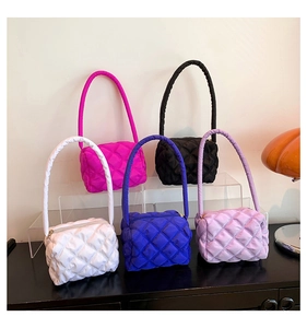 Quilted nylon shoulder bags in five vibrant colors displayed in a modern interior setting