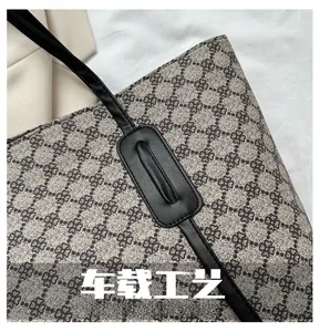 Close-up of neat stitching and vintage clover pattern on waterproof canvas tote bag