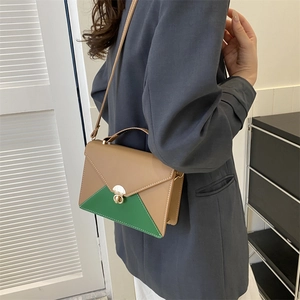 Women's two-tone contrast envelope crossbody bag in khaki and dark green with gold clasp