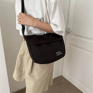 Large capacity black Oxford cloth messenger bag with adjustable strap for travel and sports