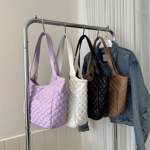 Quilted faux leather tote bags in four colors with floral metal logo for daily commuting