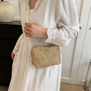 Women's summer woven straw crossbody bag with fine shoulder strap and compact rectangular shape