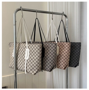 Close-up of high-capacity tote bags in four classic colors with geometric patterns