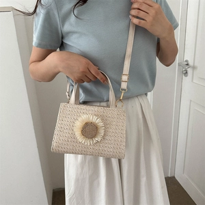 Straw woven crossbody bag with sunflower detail and adjustable strap for women