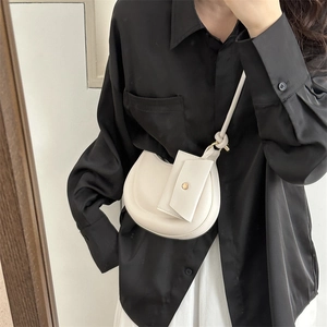 Elegant white half-moon crossbody bag with chain and small pendant for women