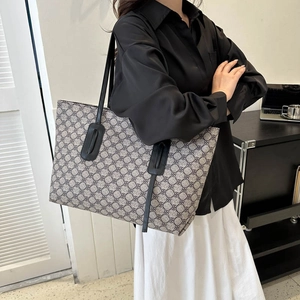 Large capacity grey tote bag with geometric floral pattern and black leather straps