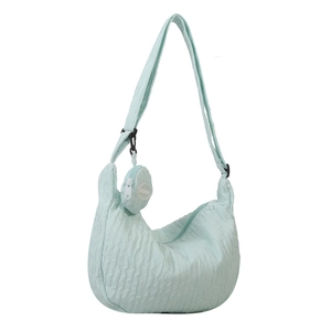 Mint green pleated shoulder bag with adjustable strap and a matching round coin purse