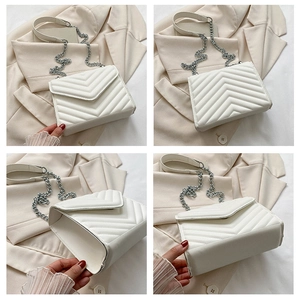 Detail views of white V-quilted leather crossbody bag with silver chain strap and envelope flap