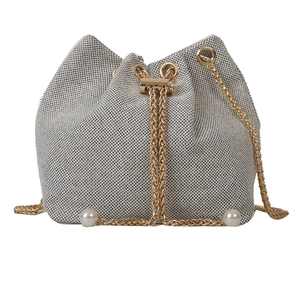 Chic woven tweed bucket bag with gold chain drawstring and elegant pearl accents