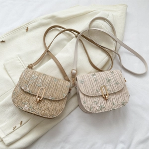 Chic woven crossbody bag with floral embroidery and golden metal clasp for summer