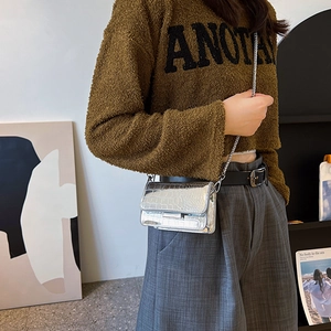 Silver crocodile texture mini chain bag with metallic finish and rectangular flap design