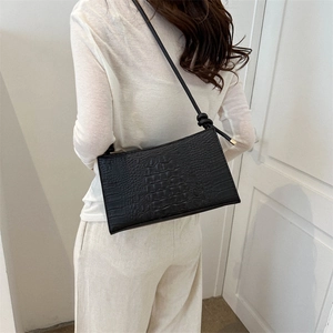 Sac sous le bras chic en relief crocodile noir avec nœud sur la bandoulière