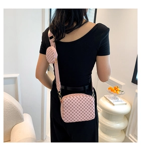 Pink quilted crossbody bag with matching round coin purse and wide nylon strap