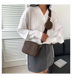 Detail of checkered crossbody bag with adjustable wide strap and round coin pouch