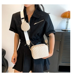 Detail of a two-in-one crossbody bag with geometric patterns and a round coin purse