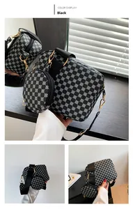 Detail view of black and white geometric printed crossbody bag with a round coin pouch