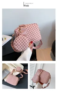 Detail of pink monogram crossbody bag set with wide strap and round coin purse accessory