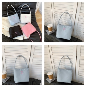 Collection of nylon tote bags in blue, beige, black, and pink with moon embroidery