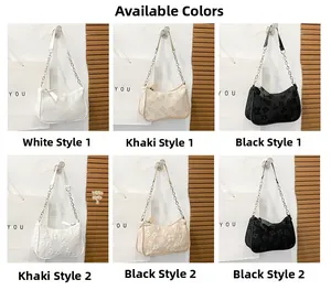 Detail showing various colors and textures of trendy pleated shoulder bags with chain straps