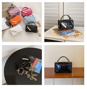 Detail view of mini croc-effect crossbody bags in six vibrant colors with gold chain straps