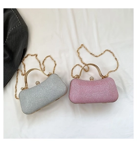 Detailed top view of sparkling evening clutch bags with metallic frames and crystal clasps