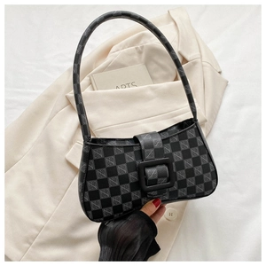 Detail of checkered shoulder bag with monogram texture and matte black buckle